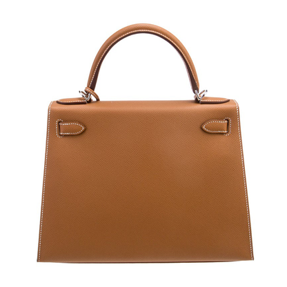 Warm Golden Tan Fine Grain Angular Structured Trapezoid Handbag With Contrast Stitching And Sleek Silvery Twist Lock Hardware