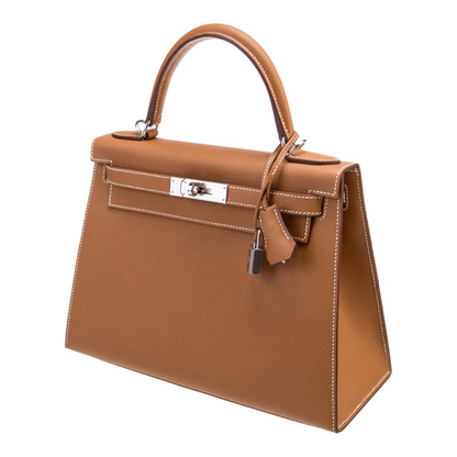 Warm Golden Tan Fine Grain Angular Structured Trapezoid Handbag With Contrast Stitching And Sleek Silvery Twist Lock Hardware