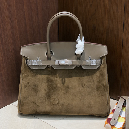 Warm Taupe Dual Texture Medium Structured Trapezoid Tote With Muted Grey Overlay And Polished Silvery Twist Lock Hardware Detail