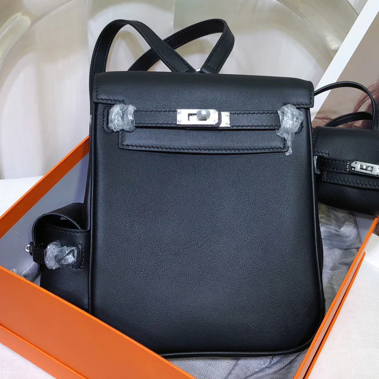 Sleek Solid Black Compact Vertical Flap Backpack With Side Mini Pouch And Polished Silvery Twist Lock Hardware Accent