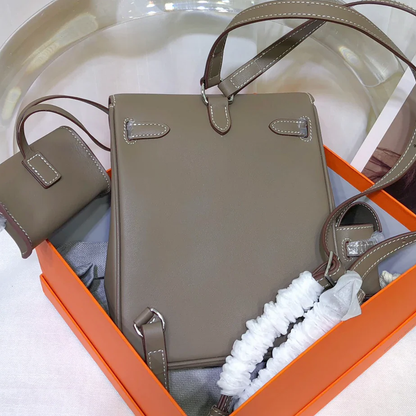 Muted Elephant Grey Vertical Flap Backpack With Pale Contrast Stitching And Side Matching Mini Accessory Pouch